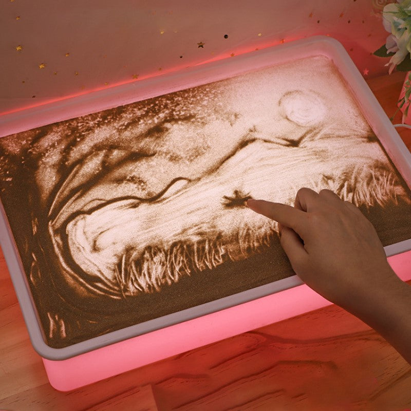 Afbeelding toont "SandArtBox - Creatieve Lichtbak Voor Zandkunst En Tekenen", perfect voor het maken van unieke zandtekeningen.