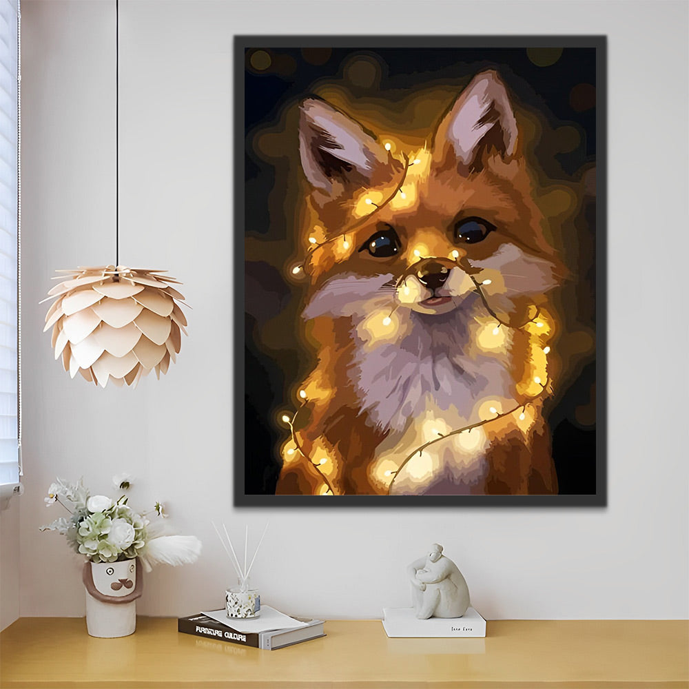 Verlichte canvasdecoratie met een charmante vos en warme lichtaccenten.
